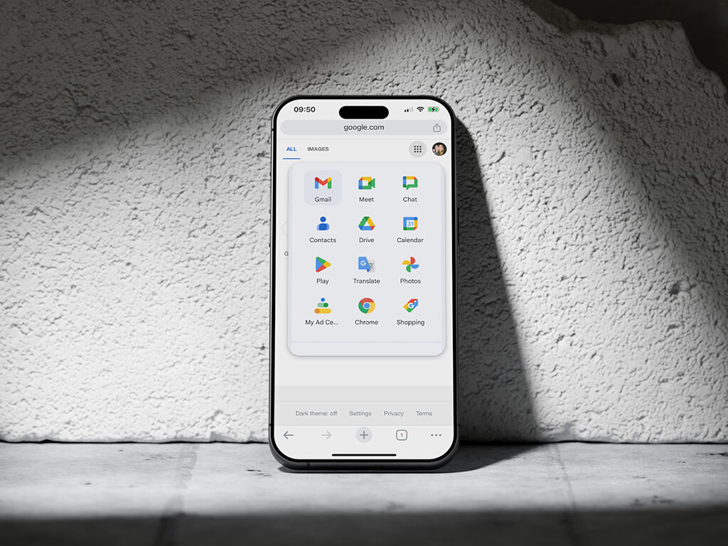 A smartphone screen displaying a grid of Google app icons. The phone is placed against a textured, light-colored surface. This image demonstrates the Gestalt principle of similarity, where objects with similar attributes (like shape or color) are perceived as part of a group