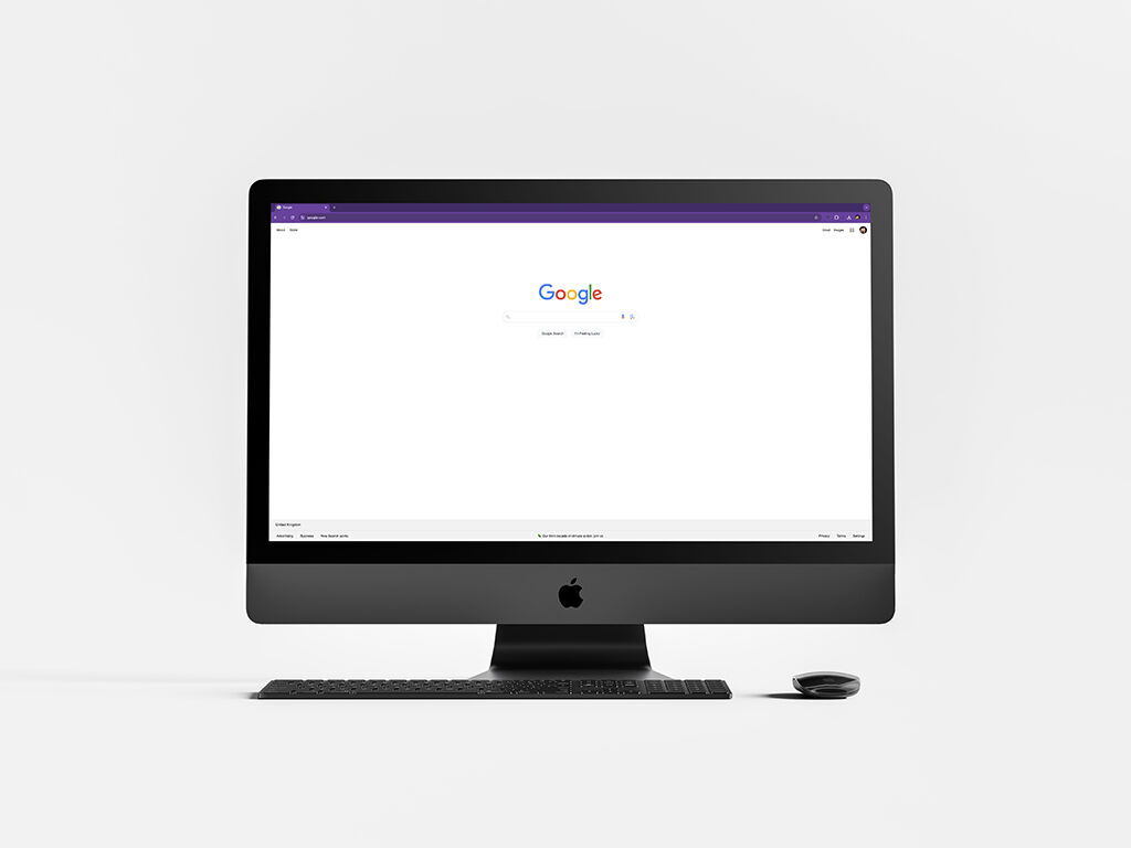 A desktop computer screen displaying the Google homepage on a plain white background. The simplicity and balanced layout demonstrate the Gestalt principle of symmetry, where elements are evenly distributed to create a sense of balance and harmony.